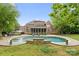 Gorgeous backyard featuring a large in-ground pool, patio, and screened porch perfect for entertaining at 7600 Brookmont Ln, Waxhaw, NC 28173