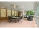 Inviting screened porch with dining and seating, open to the backyard at 7600 Brookmont Ln, Waxhaw, NC 28173