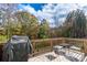 Spacious wooden back deck complete with patio furniture and a Weber grill, perfect for outdoor entertaining at 8419 Everwood Ave, Huntersville, NC 28078