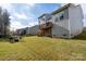 A spacious backyard has a wood deck and fire pit with seating at 8419 Everwood Ave, Huntersville, NC 28078