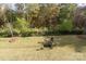 A well-kept backyard features a metal fence and a cozy fire pit with chairs at 8419 Everwood Ave, Huntersville, NC 28078
