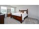 Comfortable bedroom with plush bedding and natural light at 8419 Everwood Ave, Huntersville, NC 28078