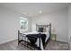 Cozy bedroom featuring a black metal bed frame and minimalist design at 8419 Everwood Ave, Huntersville, NC 28078