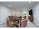 Bright bonus room showcasing a cozy seating area and contemporary design at 8419 Everwood Ave, Huntersville, NC 28078
