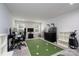 Versatile bonus room with a fun putting green, great for recreation at 8419 Everwood Ave, Huntersville, NC 28078