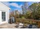 Wooden deck with seating, a grill, and a peaceful, wooded view at 8419 Everwood Ave, Huntersville, NC 28078