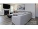 Comfortable living room featuring a large sofa, fireplace, and artwork at 8419 Everwood Ave, Huntersville, NC 28078