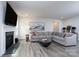 Stylish living room with a fireplace, large TV, comfortable sofa, and tasteful decor at 8419 Everwood Ave, Huntersville, NC 28078