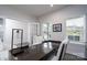 Cozy office area featuring a sleek desk, two windows providing natural light, and comfortable seating at 8419 Everwood Ave, Huntersville, NC 28078