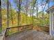 Back deck overlooking a wooded lot with mature trees and greenery at 845 Creek Bluff Rd, Rock Hill, SC 29732
