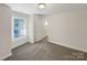 Bedroom featuring neutral walls and carpet floors, with natural light through the windows at 845 Creek Bluff Rd, Rock Hill, SC 29732