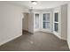 Bright bedroom featuring carpet floors, multiple windows, and white trim at 845 Creek Bluff Rd, Rock Hill, SC 29732