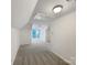 Bright bonus room with carpet and a view from the window in a new home at 845 Creek Bluff Rd, Rock Hill, SC 29732