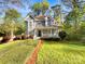 Charming two-story home with a manicured lawn and beautiful landscaping at 845 Creek Bluff Rd, Rock Hill, SC 29732