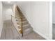 Hallway features carpet floor and stairs with a wooden banister and white railing at 845 Creek Bluff Rd, Rock Hill, SC 29732