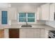 Updated kitchen with stainless steel sink, white cabinets, and granite countertops at 845 Creek Bluff Rd, Rock Hill, SC 29732