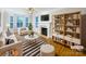 Bright living room features a fireplace, built-in shelving, and stylish decor for a comfortable and inviting space at 845 Creek Bluff Rd, Rock Hill, SC 29732