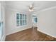 Bright room featuring hardwood floors, large windows, and a decorative front door entryway at 845 Creek Bluff Rd, Rock Hill, SC 29732