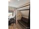 Bedroom with a sleeper sofa, wood paneled wall and built-in cabinets at 103 Hidaway Trl # 99A, Mount Gilead, NC 27306