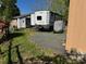 Back exterior view of the RV showing storage and a bicycle at 103 Hidaway Trl # 99A, Mount Gilead, NC 27306