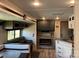 Living area with couch, built-in fireplace and kitchen at 103 Hidaway Trl # 99A, Mount Gilead, NC 27306