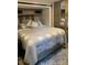 Main bedroom features a queen sized bed with overhead storage and mirrored closets at 103 Hidaway Trl # 99A, Mount Gilead, NC 27306
