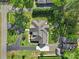 An aerial view of the house, roof, driveway, yard and outbuildings on the property at 10416 Glenmac Rd, Charlotte, NC 28215