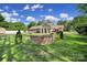 Well-manicured backyard featuring a custom brick half-wall and a lush green lawn at 10416 Glenmac Rd, Charlotte, NC 28215