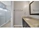 Modern bathroom showcasing a sleek vanity, a contemporary mirror, and a frameless glass shower at 10416 Glenmac Rd, Charlotte, NC 28215