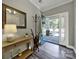 Welcoming foyer with hardwood floors, stylish decor, and a view of the beautiful front porch at 10416 Glenmac Rd, Charlotte, NC 28215