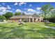 Charming home with a lush green lawn, a stone walkway, and an inviting covered porch, perfect for outdoor enjoyment at 10416 Glenmac Rd, Charlotte, NC 28215