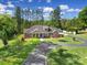Beautiful home with landscaped front yard and circular driveway at 10416 Glenmac Rd, Charlotte, NC 28215
