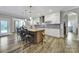 Bright, modern kitchen with island seating, stainless steel appliances, and ample counter space at 10416 Glenmac Rd, Charlotte, NC 28215