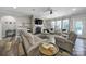 Comfortable living room featuring a cozy fireplace, large windows, and stylish furnishings at 10416 Glenmac Rd, Charlotte, NC 28215