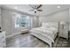 Serene main bedroom with a large window, plush carpeting, and neutral tones, providing a relaxing space at 10416 Glenmac Rd, Charlotte, NC 28215