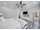 Comfortable main bedroom featuring a ceiling fan and an adjacent dressing area, providing a practical layout at 10416 Glenmac Rd, Charlotte, NC 28215