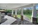 Covered patio with stone pillars, an outdoor grill, and a view of the backyard, perfect for entertaining at 10416 Glenmac Rd, Charlotte, NC 28215