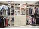 Organized walk-in closet with custom shelving and hanging rods, maximizing storage space for clothing and accessories at 10416 Glenmac Rd, Charlotte, NC 28215