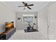 Relaxing bedroom featuring neutral colors, an exercise bike, and great natural light for a peaceful atmosphere at 10423 Drake Hill Dr, Huntersville, NC 28078