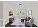 Cozy bonus room featuring a comfortable seating area and natural light, ideal for relaxation or entertainment at 10423 Drake Hill Dr, Huntersville, NC 28078