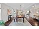 Spacious dining room with hardwood floors, complemented by modern decor, creating an inviting atmosphere at 10423 Drake Hill Dr, Huntersville, NC 28078