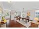Elegant dining room with hardwood floors, wainscoting, and stylish light fixture, perfect for entertaining at 10423 Drake Hill Dr, Huntersville, NC 28078
