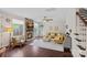 Inviting living room with a stone fireplace, large windows, and a comfortable seating arrangement at 10423 Drake Hill Dr, Huntersville, NC 28078