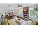 Open living area with a stone fireplace, plush seating, and seamless flow to the dining and kitchen areas at 10423 Drake Hill Dr, Huntersville, NC 28078