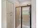 Tiled shower with glass doors and a built in niche at 10423 Drake Hill Dr, Huntersville, NC 28078