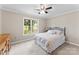 Bedroom with a large window that provides natural light and views of the outside landscape at 109 Wren Ln, Mooresville, NC 28117