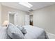 Calming bedroom with neutral-toned bed, soft carpet, and lamps, offering a cozy retreat at 109 Wren Ln, Mooresville, NC 28117
