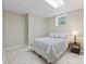 Bedroom with neutral tones, including a bed with plush pillows, carpet, and lamp at 109 Wren Ln, Mooresville, NC 28117