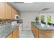 Kitchen area features ample countertop space, perfect for cooking and entertaining with backyard access at 109 Wren Ln, Mooresville, NC 28117