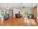 Bright living room with vaulted ceilings, hardwood floors, and a ceiling fan offers a cozy and open space at 109 Wren Ln, Mooresville, NC 28117